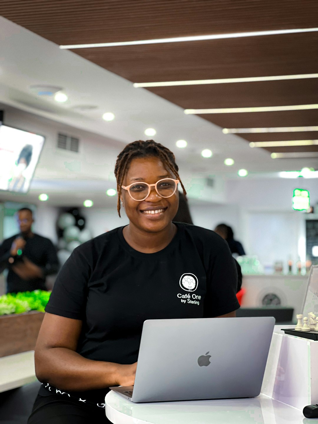 Accueil a-person-wearing-glasses-and-sitting-at-a-table-with-a-laptop-1l1yr9qnz7m